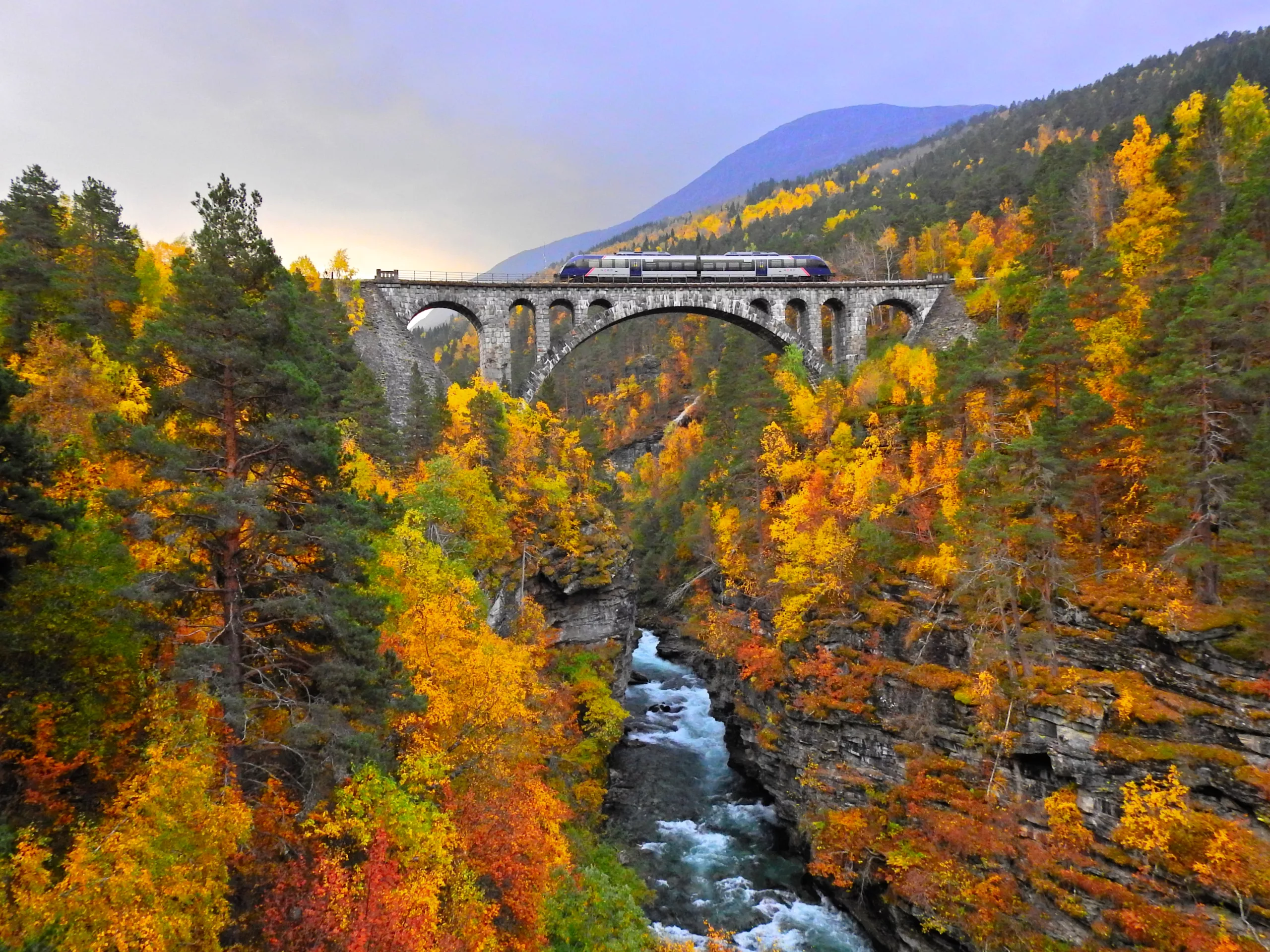 Rauma Railway train on Kylling bridge in Norway.